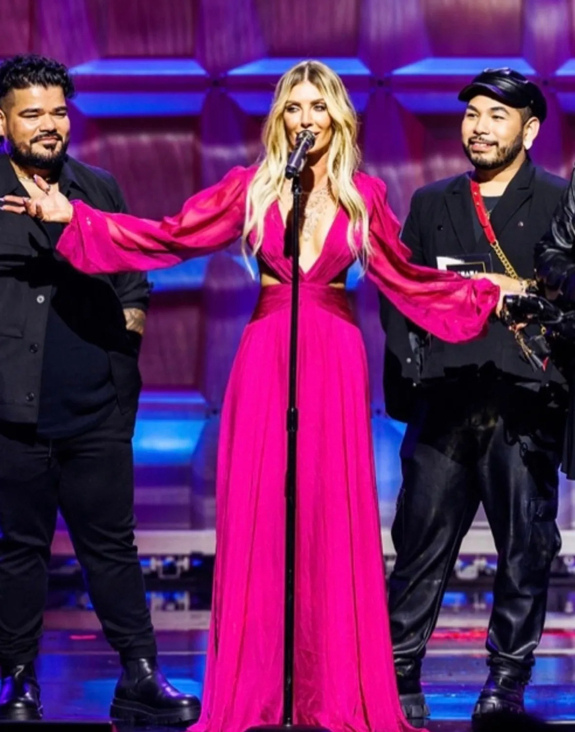Danielle Keasling on stage in a pink gown